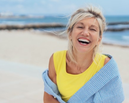 woman happy on beach in summer