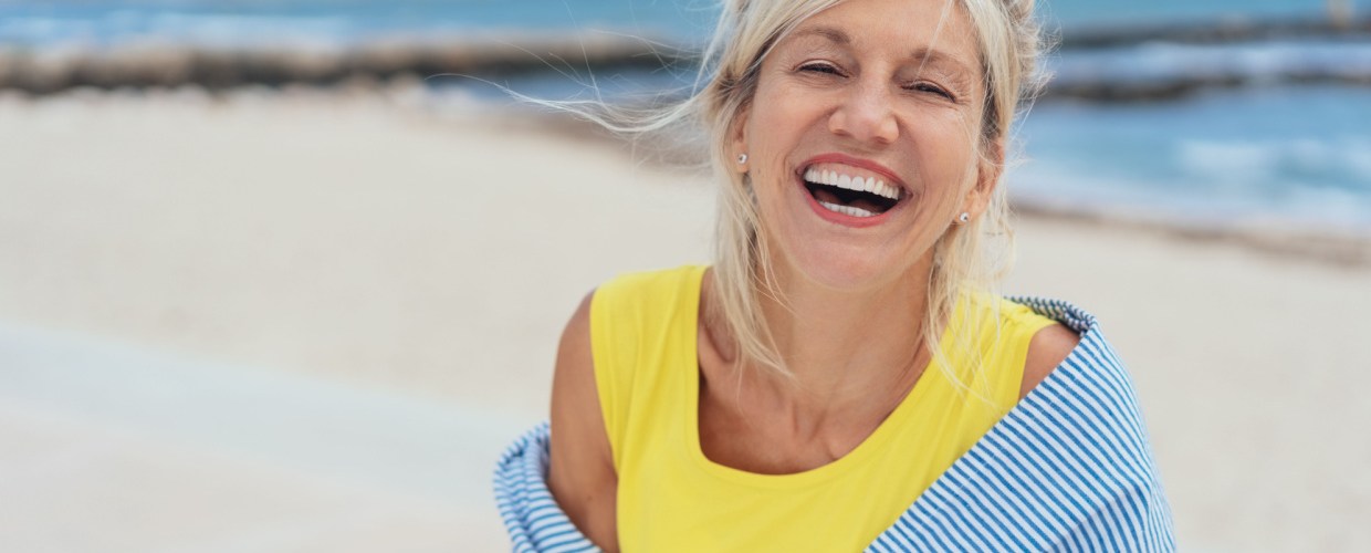 woman happy on beach in summer
