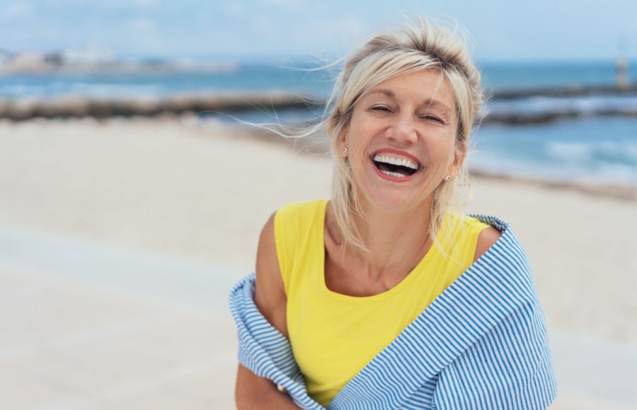 woman happy on beach in summer