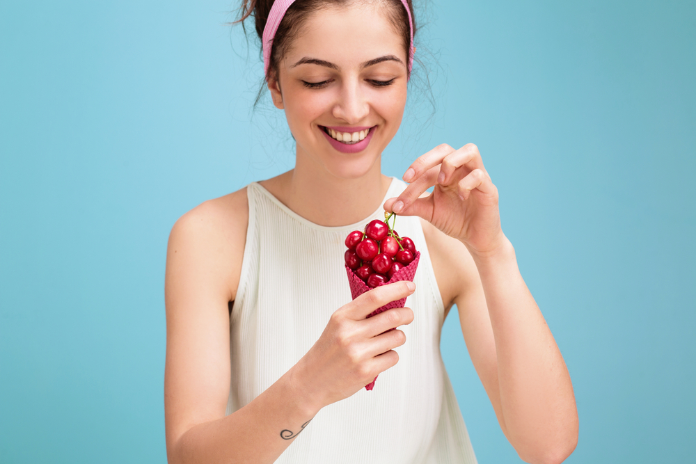 best foods for sleep woman eating cherry