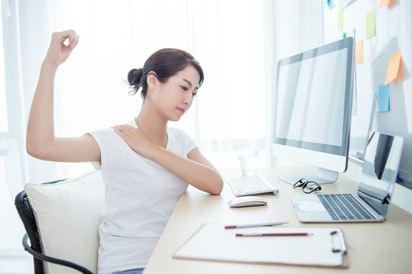 woman rotating shoulders