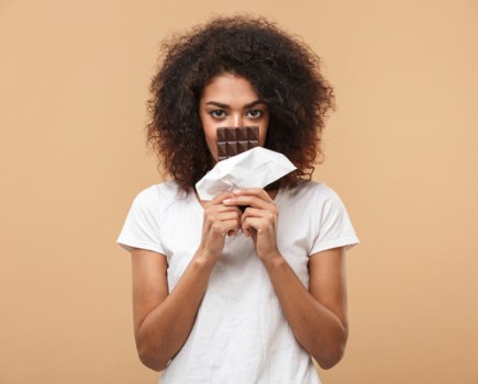 Woman eating chocolate