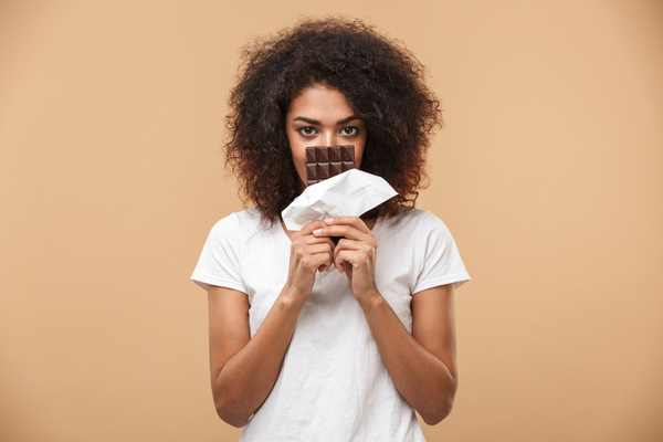 Woman eating chocolate