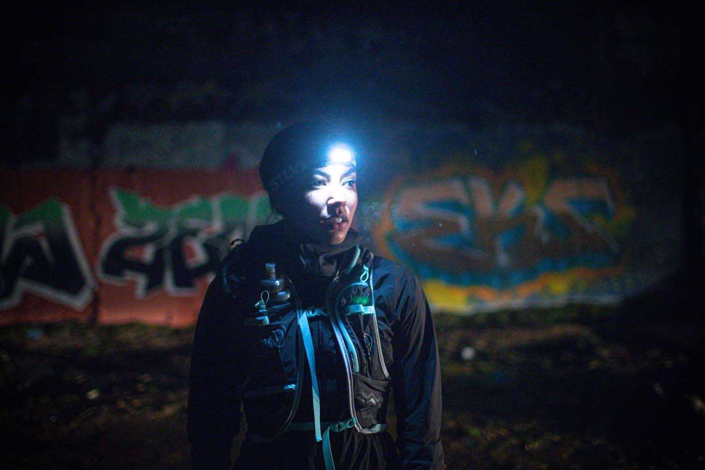 a woman wearing a head torch for cold weather running