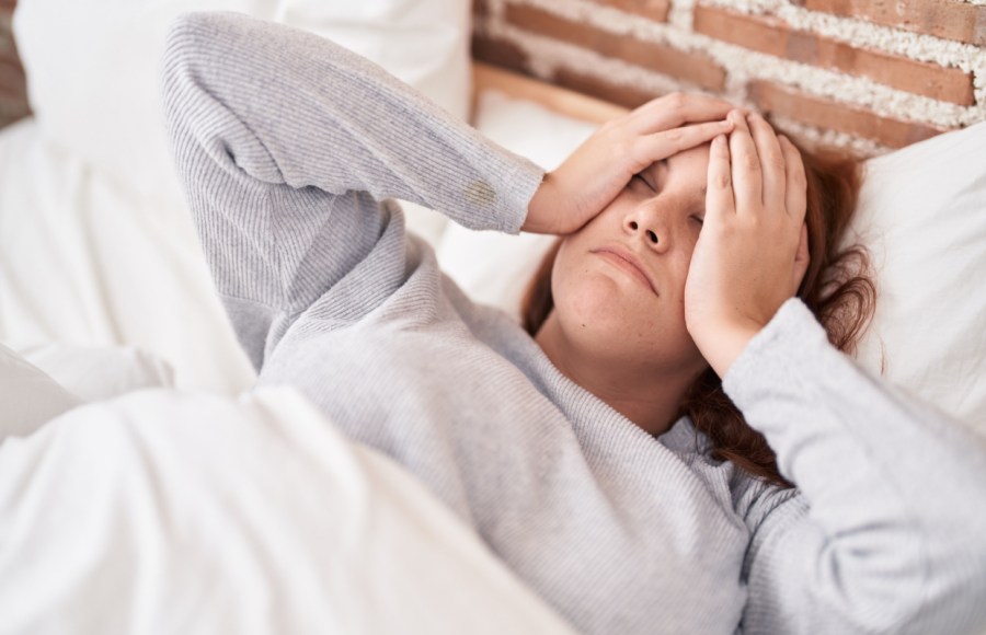 woman struggling to fall asleep sleep and weight loss concept