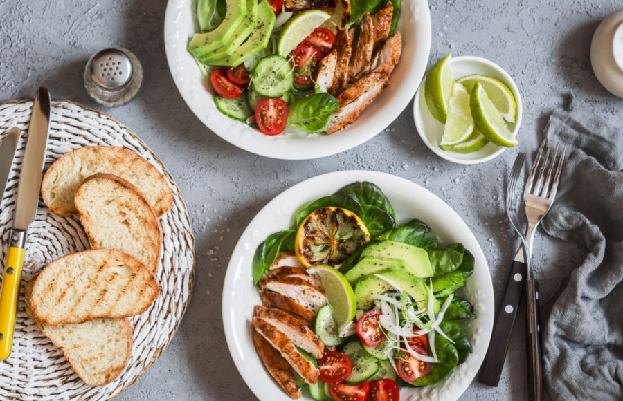 healthy dinner in bowls, chicken, avocado, salad