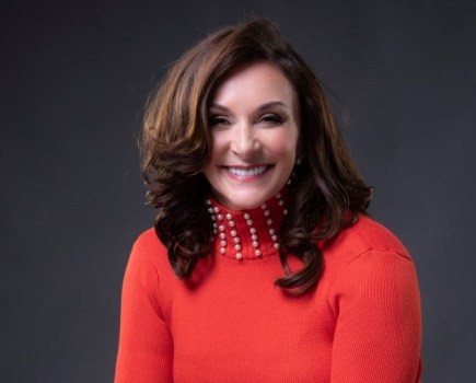 shirley ballas smiling wearing red jumper