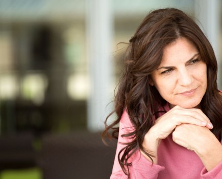 middle aged woman thinking