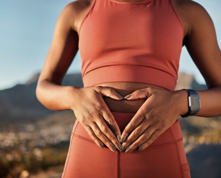 ibs concept, woman holds tummy