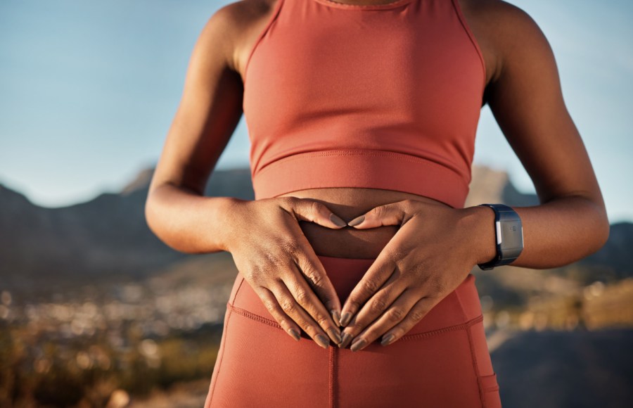 ibs concept, woman holds tummy