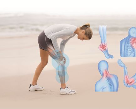 woman on beach with pain and inflammation from knee injury
