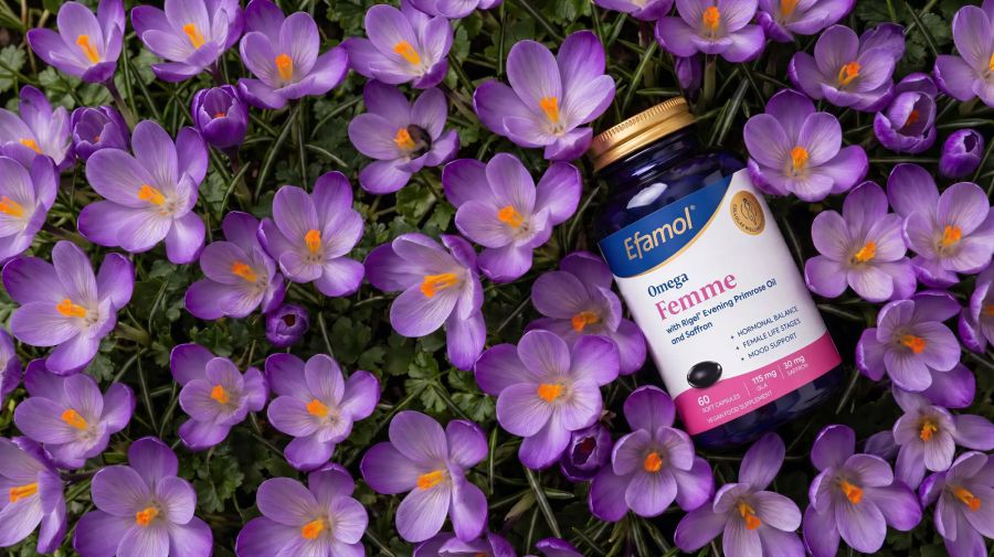 efamol omega femme supplements surrounded by crocus flowers