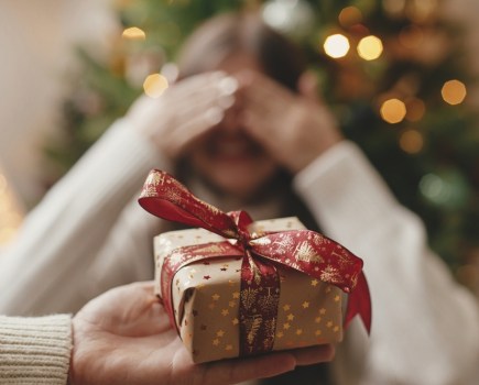 woman receiving christmas gift