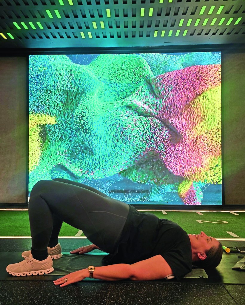 Alice trying the equipment at SIRO Dubai, and doing some yoga