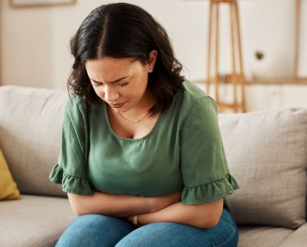 woman struggling with bloating