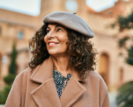 middle aged woman feeling healthy and happy in autumn season
