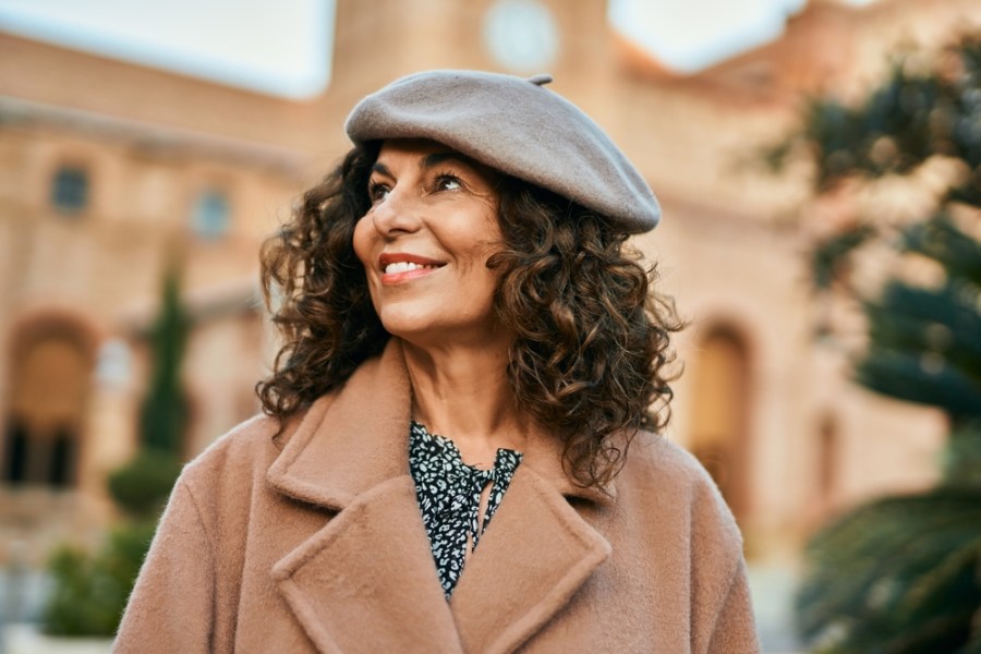 middle aged woman feeling healthy and happy in autumn season