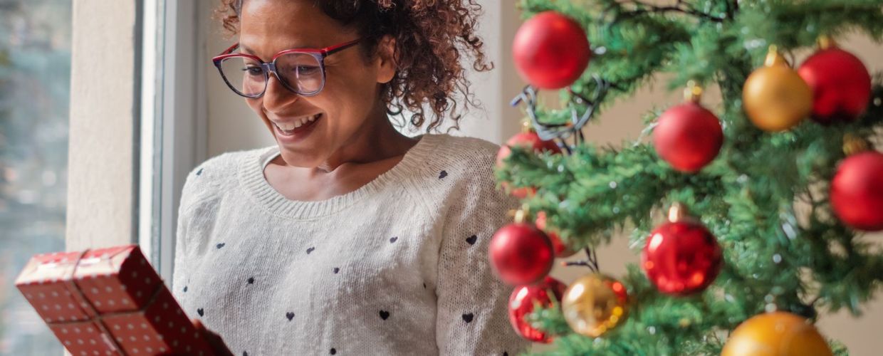 woman excited to open christmas gift