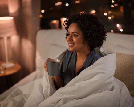 woman resting in evening bedtime routine essentials concept