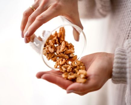 woman eating walnuts