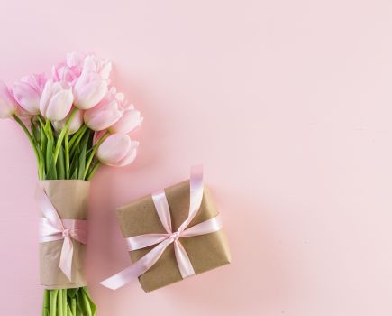 flower bouquet and wrapped present mother's day gift guide
