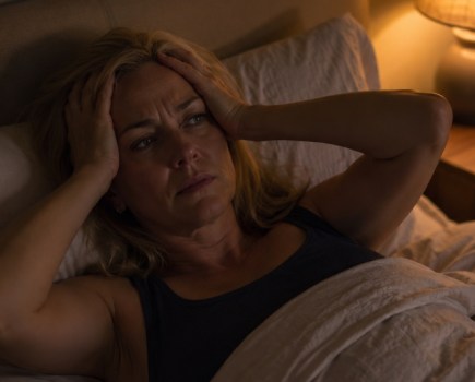 midlife woman struggling to sleep at night during menopause