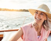 mature woman on holiday, enjoying travel experience on a boat