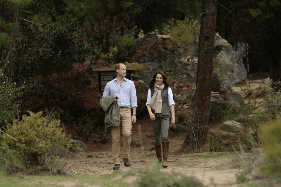 Princess Catherine and Prince William walking in a forest in Bhutan