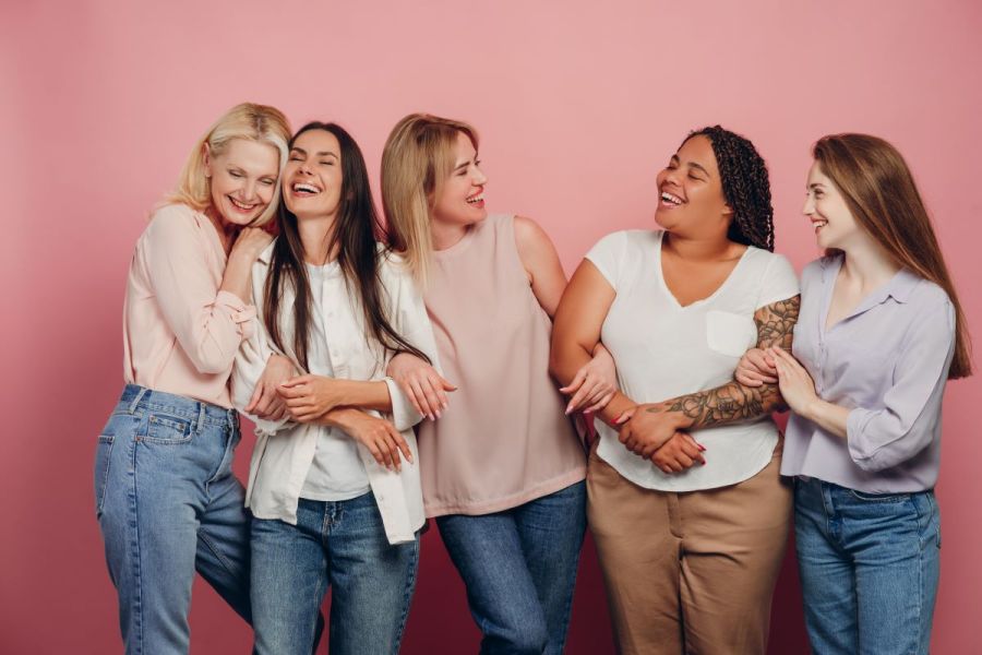 women smiling together in a group