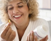 middle aged woman taking supplements for brain health