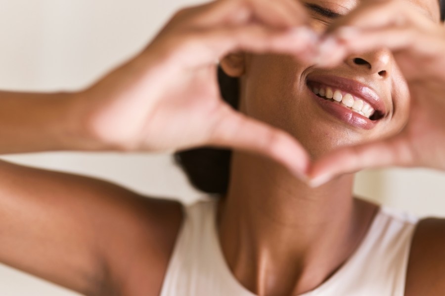 Dental,Care,Smile.,Woman,Making,A,Heart,Shape,With,Her